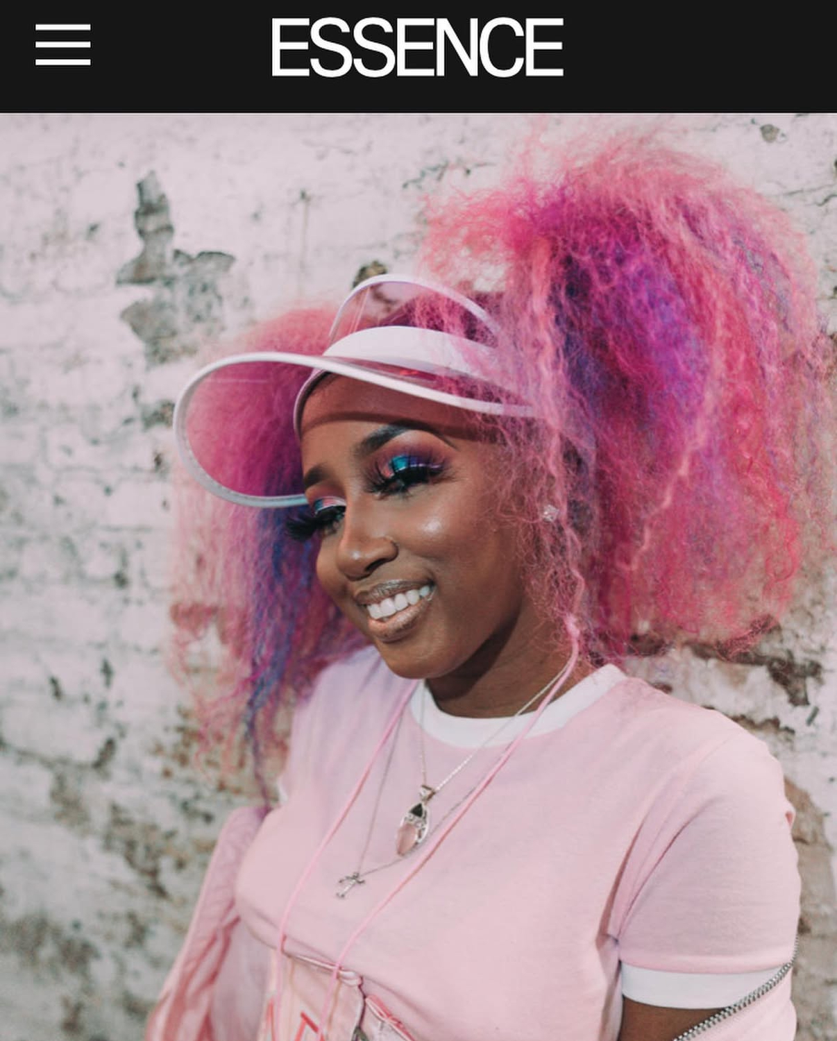 ESSENCE portrait of Yung Baby Tate in a pink styled look